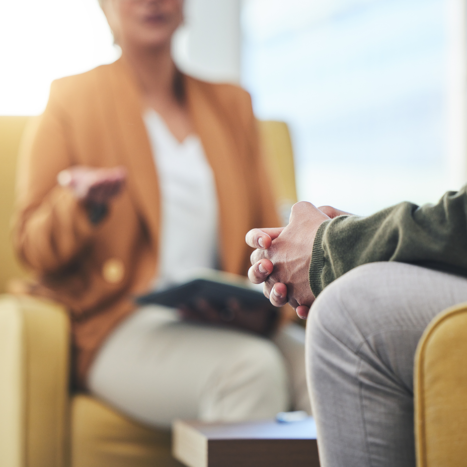 Zoom in on hands of person listening in therapy
