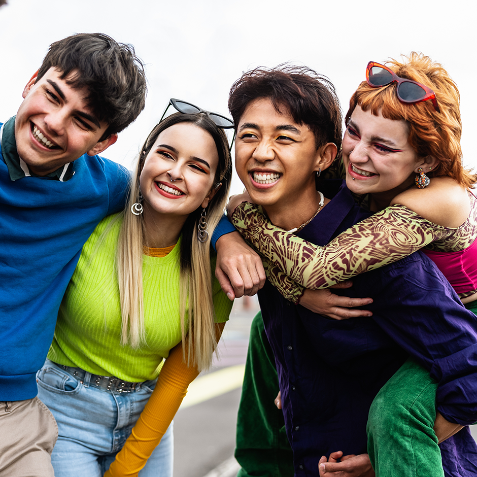 Happy young diverse friends having fun hanging out