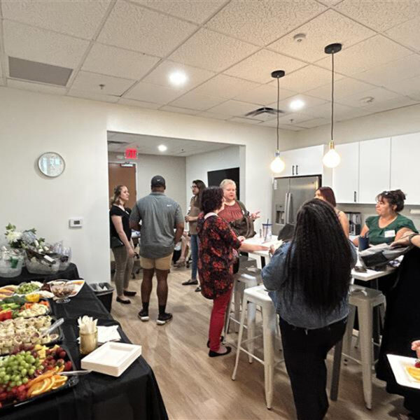 Mindful providers mingle at a provider meetup, with a spread of refreshments