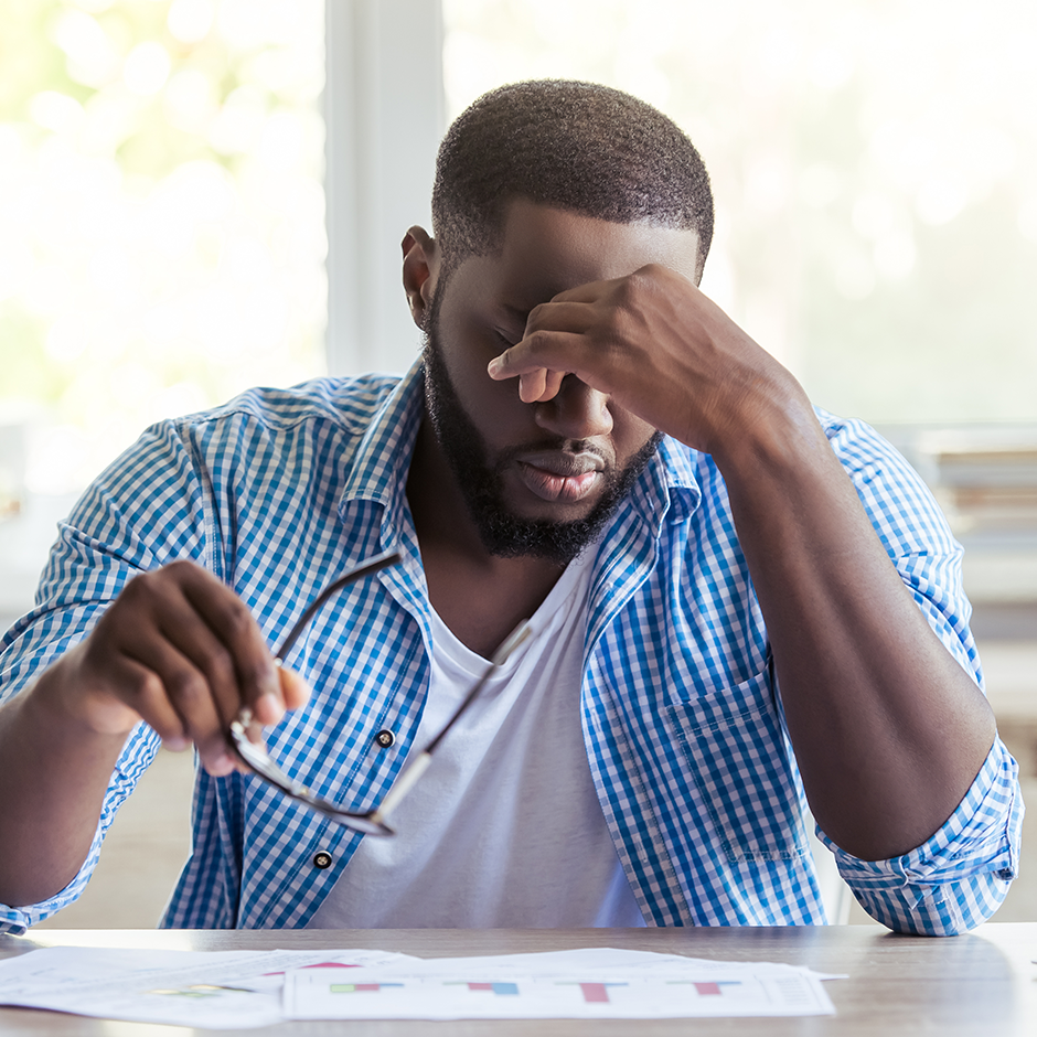 Man holding head stressed out