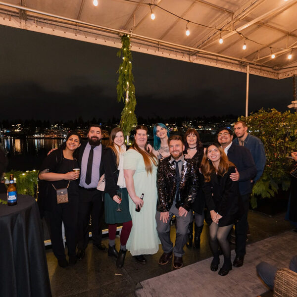 Mindful Support Services staff celebrate with the Seattle waterfront in the background