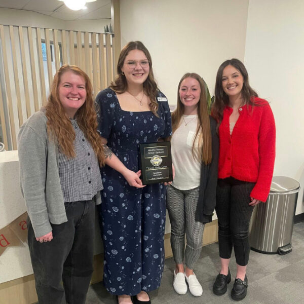 Mindful staff and leadership receive an award honoring Mindful Therapy Group's Spokane location