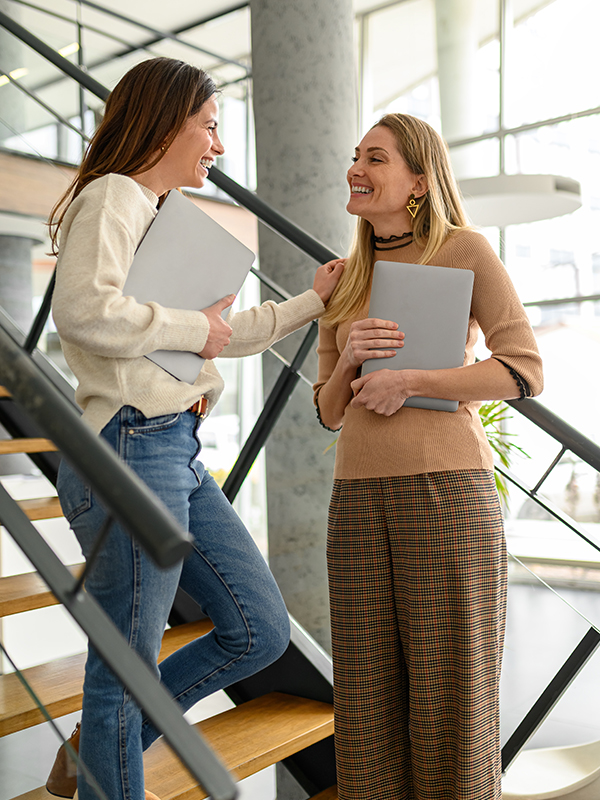 Co-workers talking on stairs